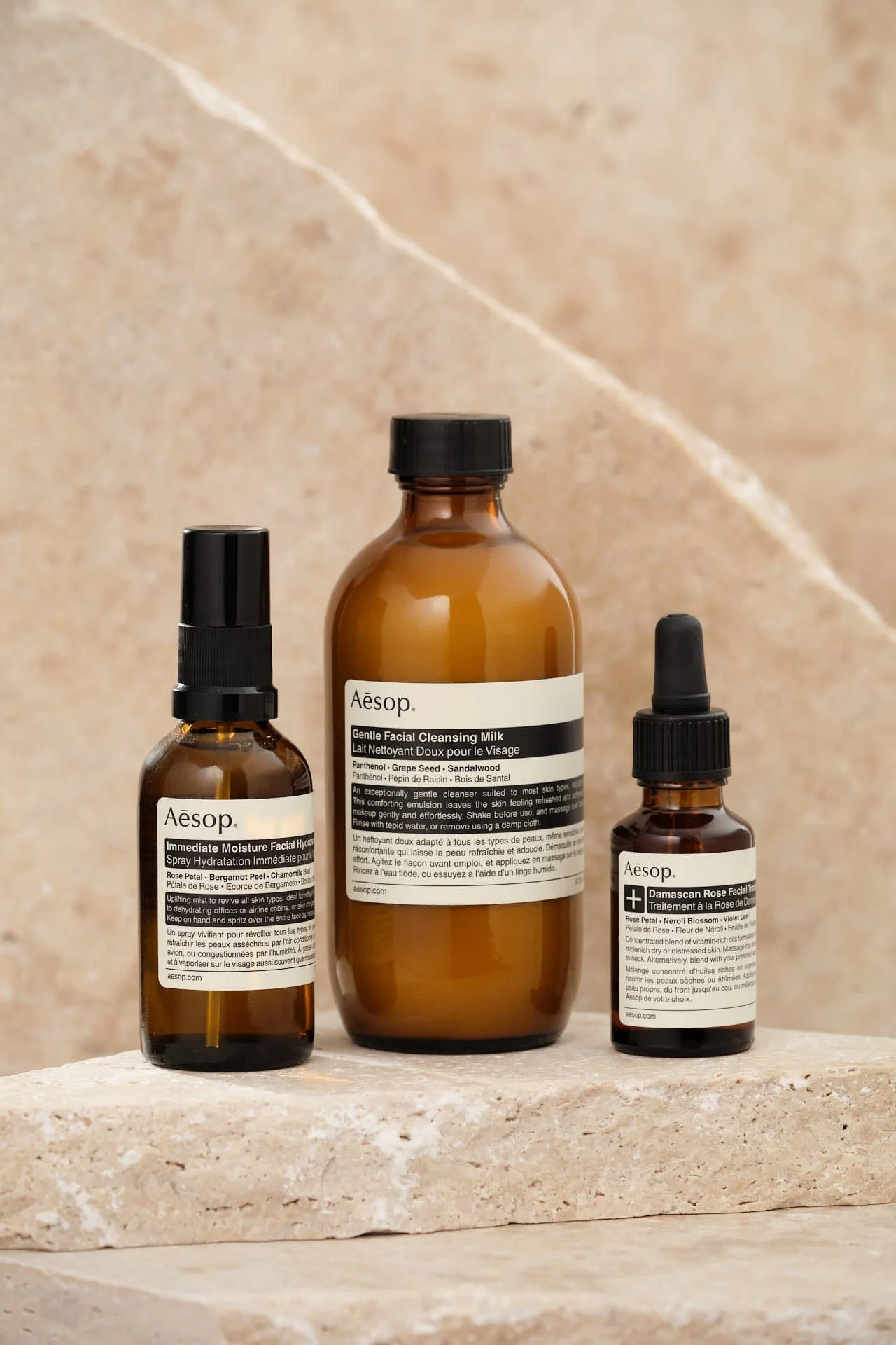 Aesop Damascan Rose Facial Treatment trio on stone