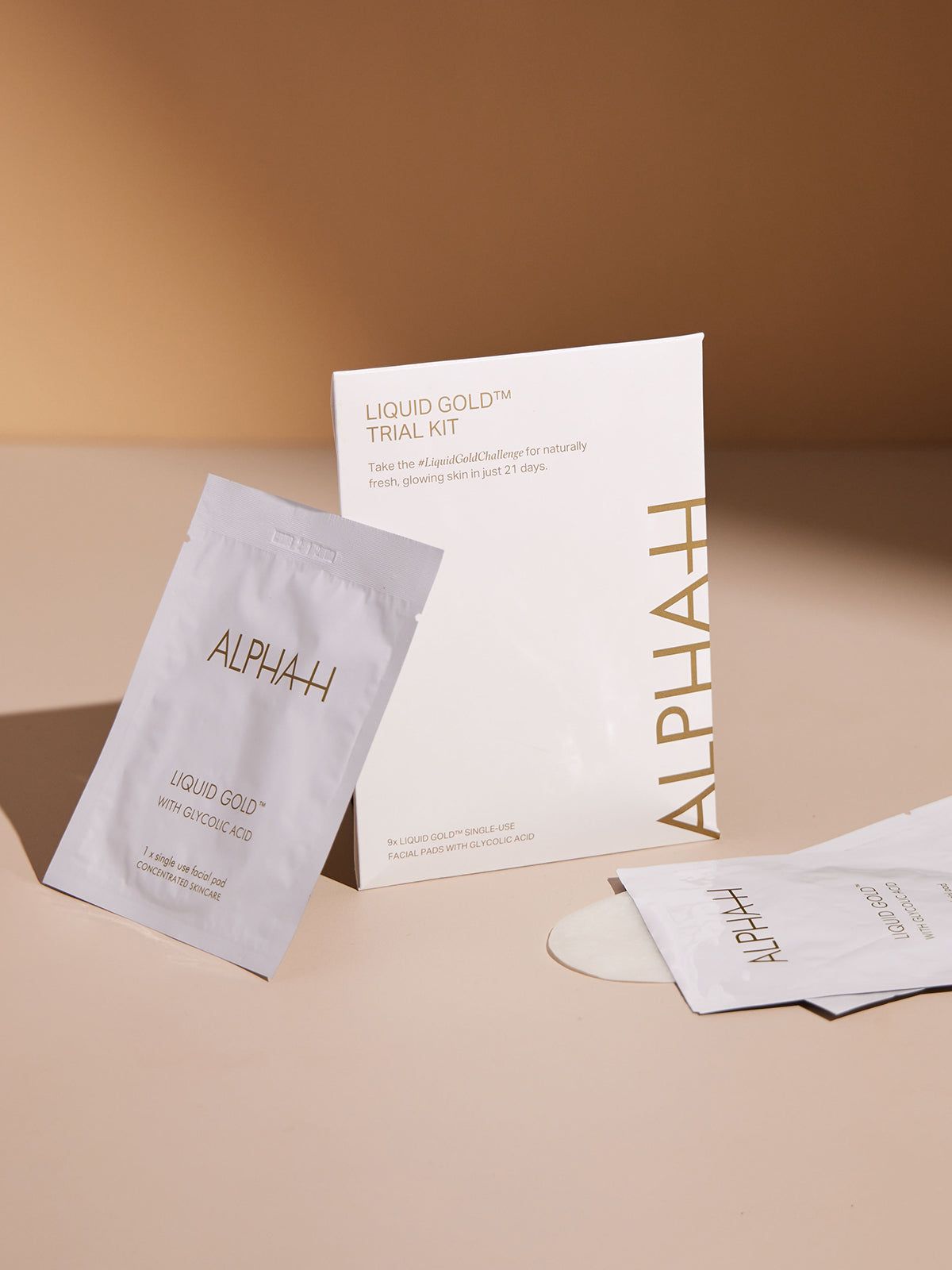 Alpha-H Liquid Gold Trial Kit on warm background