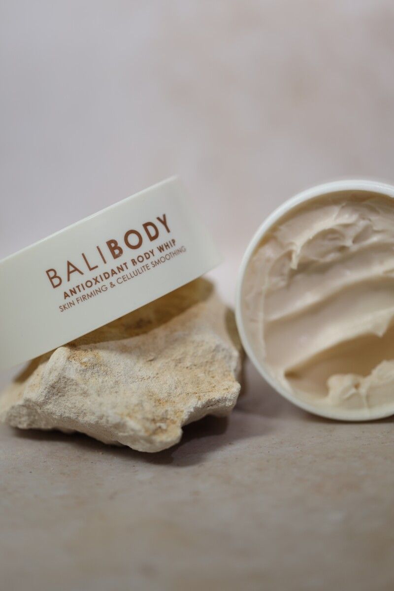 Bali Body Antioxidant Body Whip open jar on stone, skin firming and cellulite smoothing