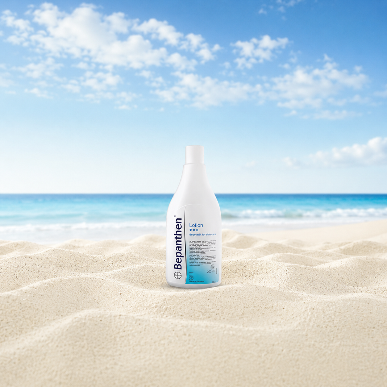 Bepanthen lotion bottle on Australian sand with summer sky