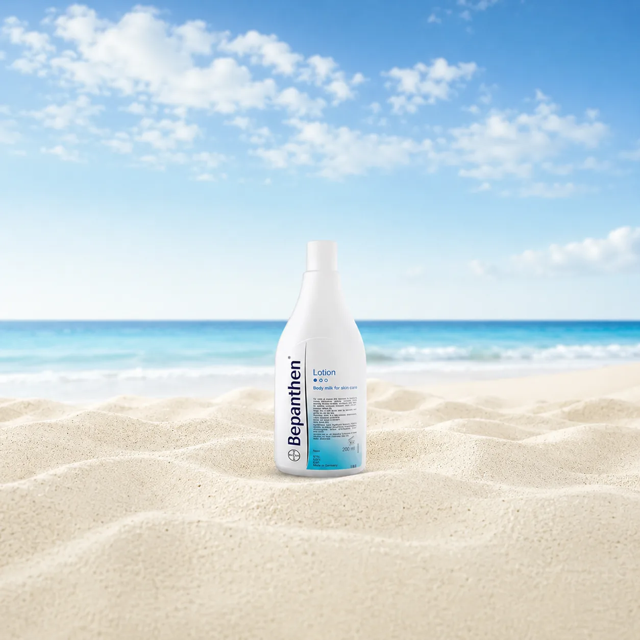 Bepanthen lotion bottle on Australian sand with summer sky