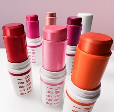 Bobbi Brown Crushed Lip and Cream Stick line-up on pink