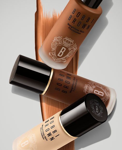 Bobbi Brown Skin Long-Wear Weightless Foundation trio on warm flatlay