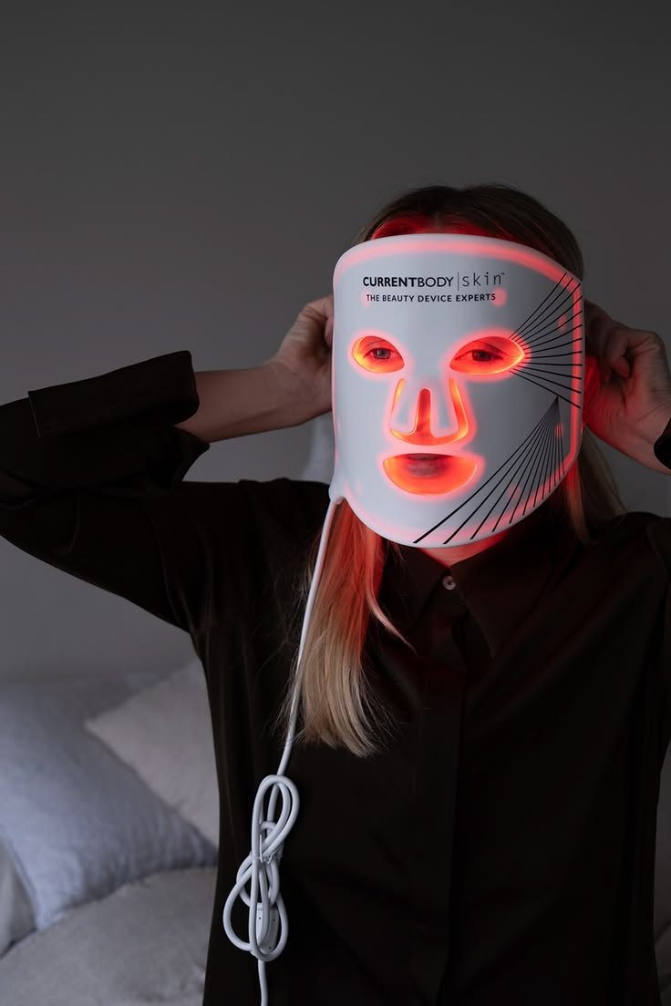 CurrentBody Skin LED Mask held in hand, flexible silicone, full-coverage form