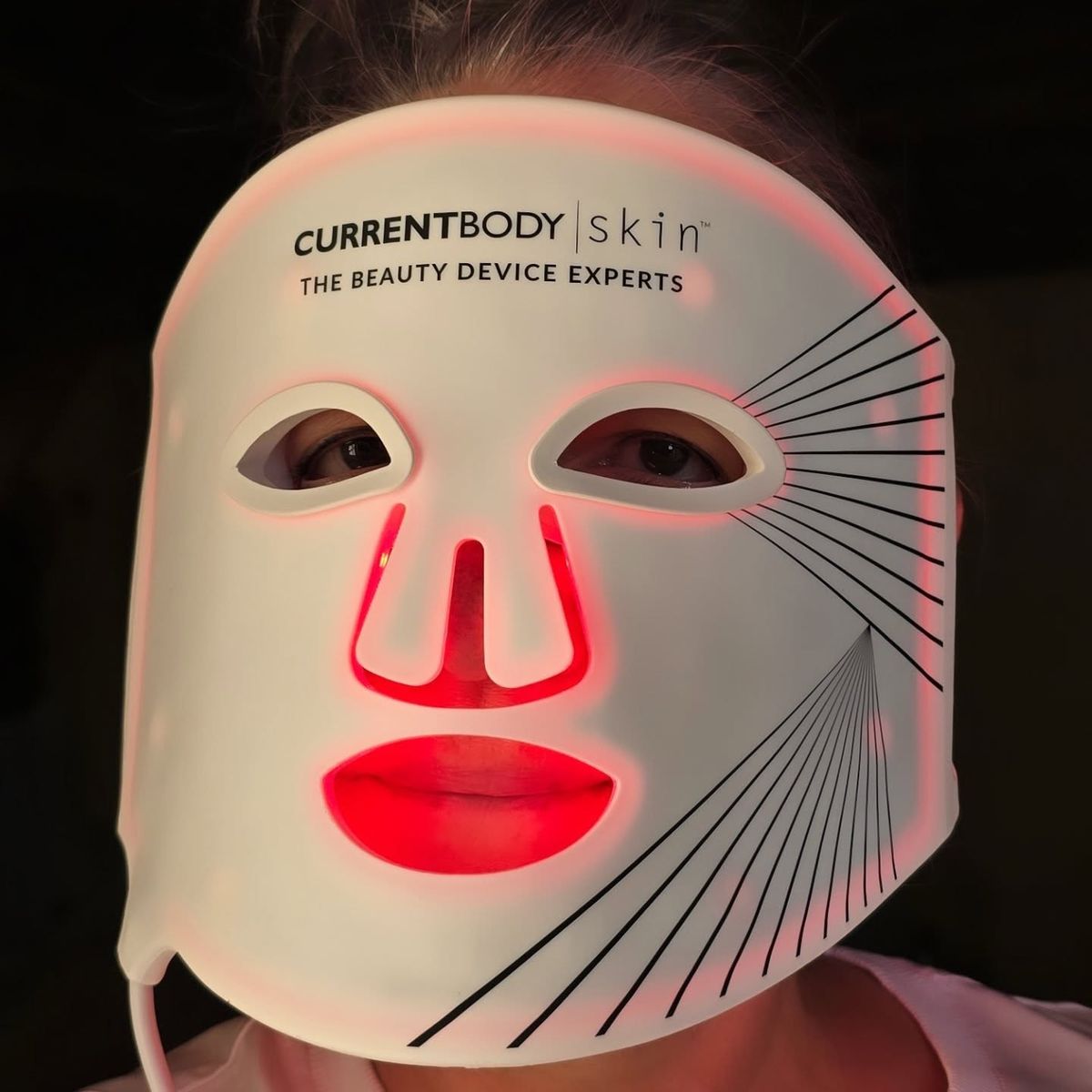 CurrentBody Skin LED Light Therapy Mask Series 2 worn close-up, flexible silicone, clinical glow