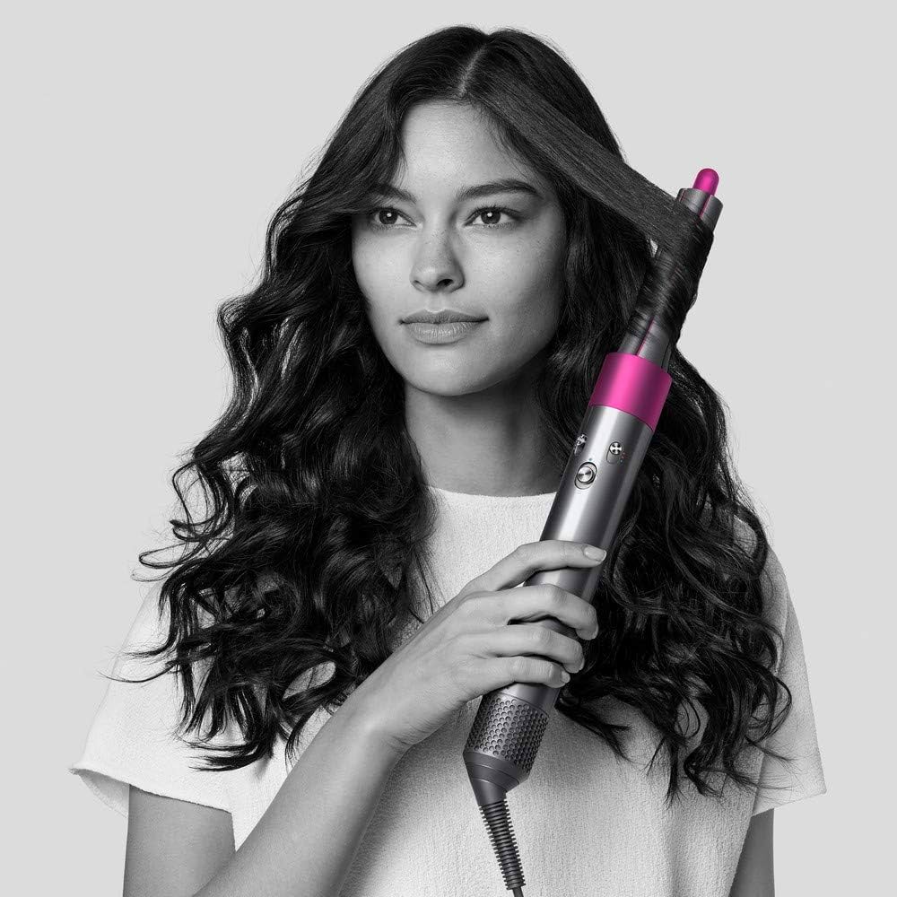 Dyson Airwrap in use, salon-grade styling at home