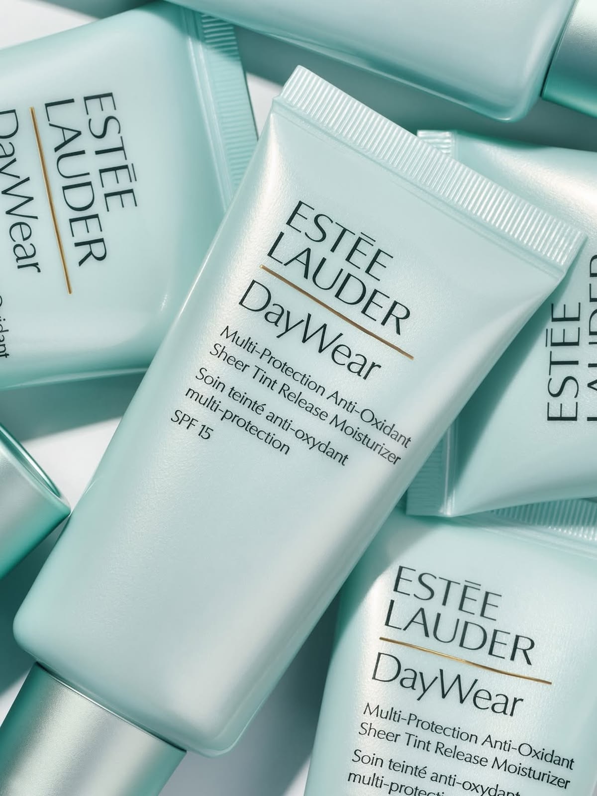 Estée Lauder DayWear teal tubes flatlay pattern
