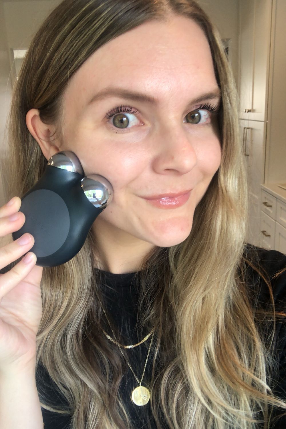 NuFACE Trinity in mirror selfie, the at-home routine in real lighting