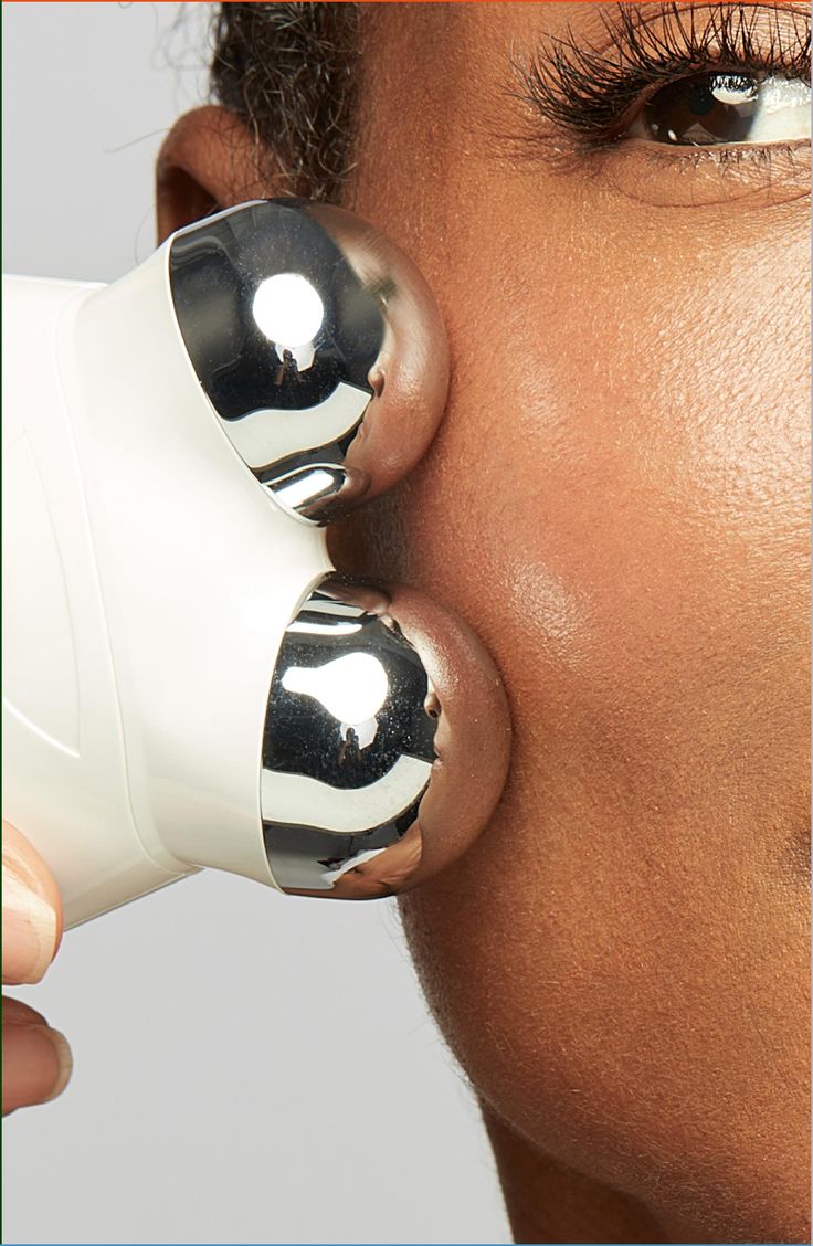NuFACE Trinity contact spheres on skin close-up, clinical microcurrent contact