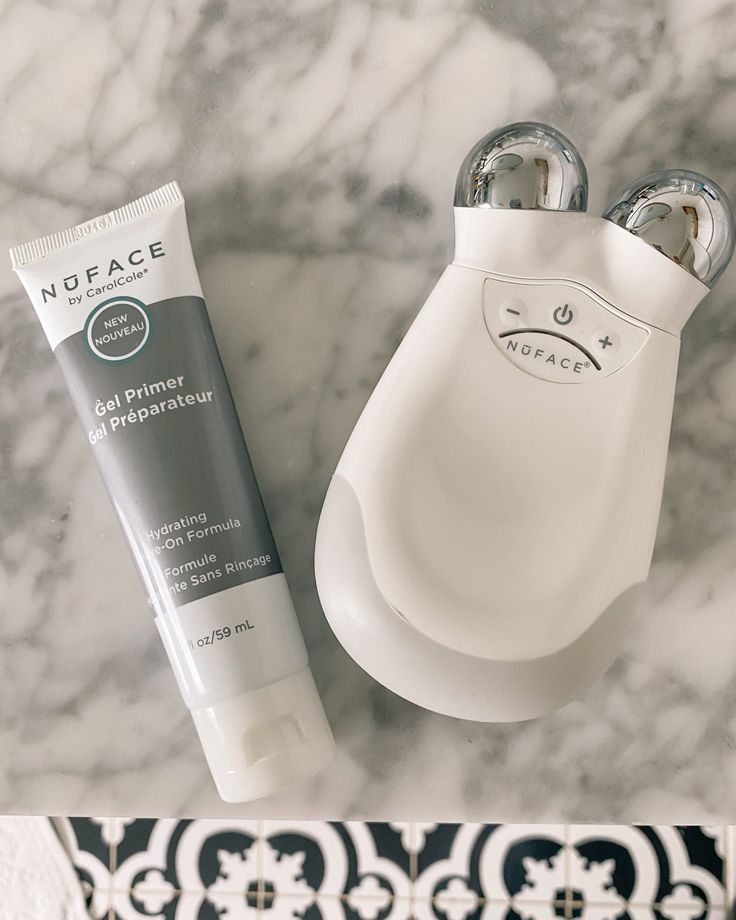 NuFACE Mini in profile use on cheek, the travel-tier entry device in routine