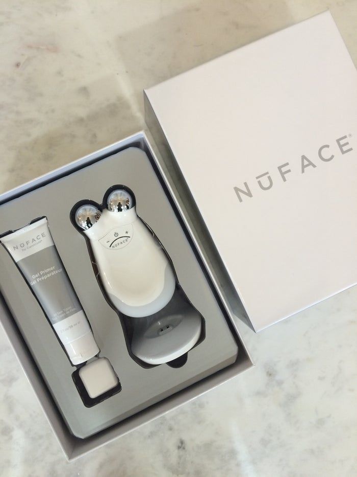 NuFACE Hydrating Aqua Gel and Trinity device on marble, the required consumable