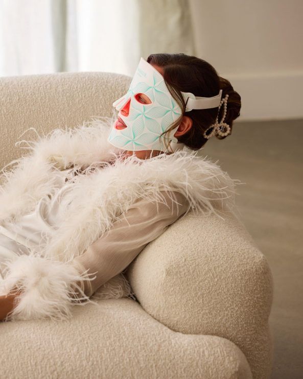 Omnilux Contour Face lifestyle, feather robe and the mask as ritual
