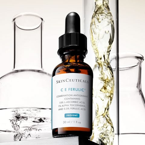 SkinCeuticals C E Ferulic with laboratory beakers