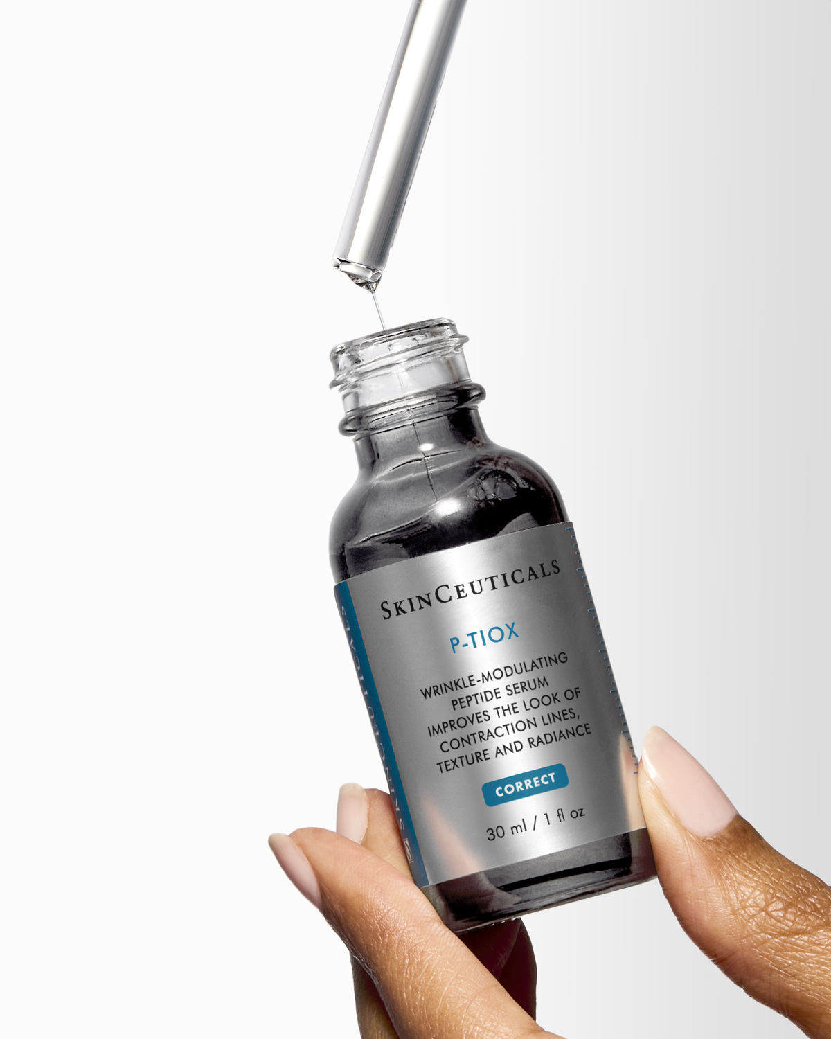 SkinCeuticals P-Tiox peptide serum in hand