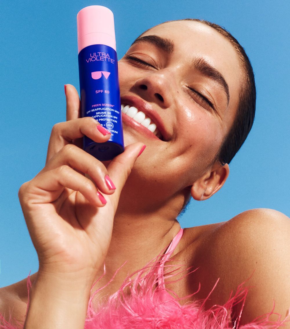 Ultra Violette product still, bottle and tube on neutral surface