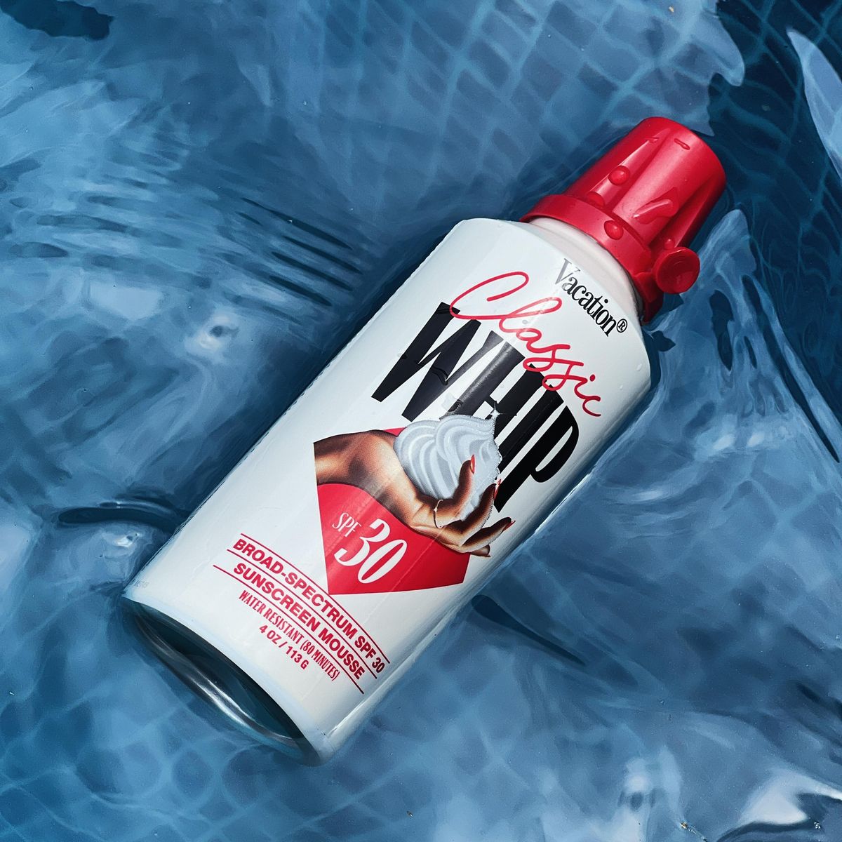 Vacation Classic Whip SPF 30 aerosol mousse in pool