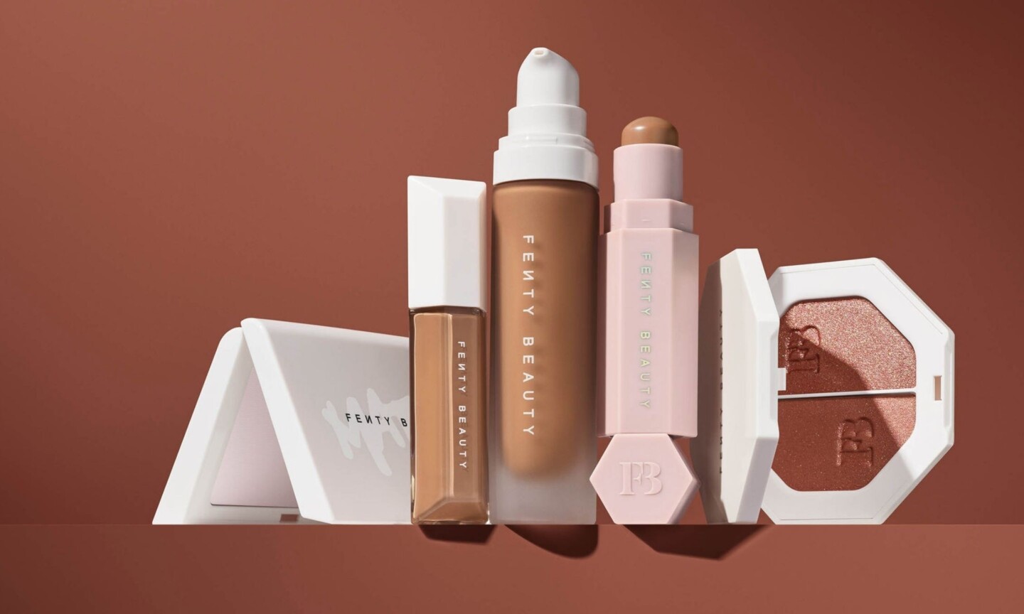 Fenty Beauty range on terracotta, Pro Filt'r, Match Stix and Killawatt highlighter
