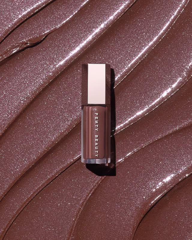 Fenty Beauty Stunna Lip Paint, fluid lip colour bottle on cocoa swirl background