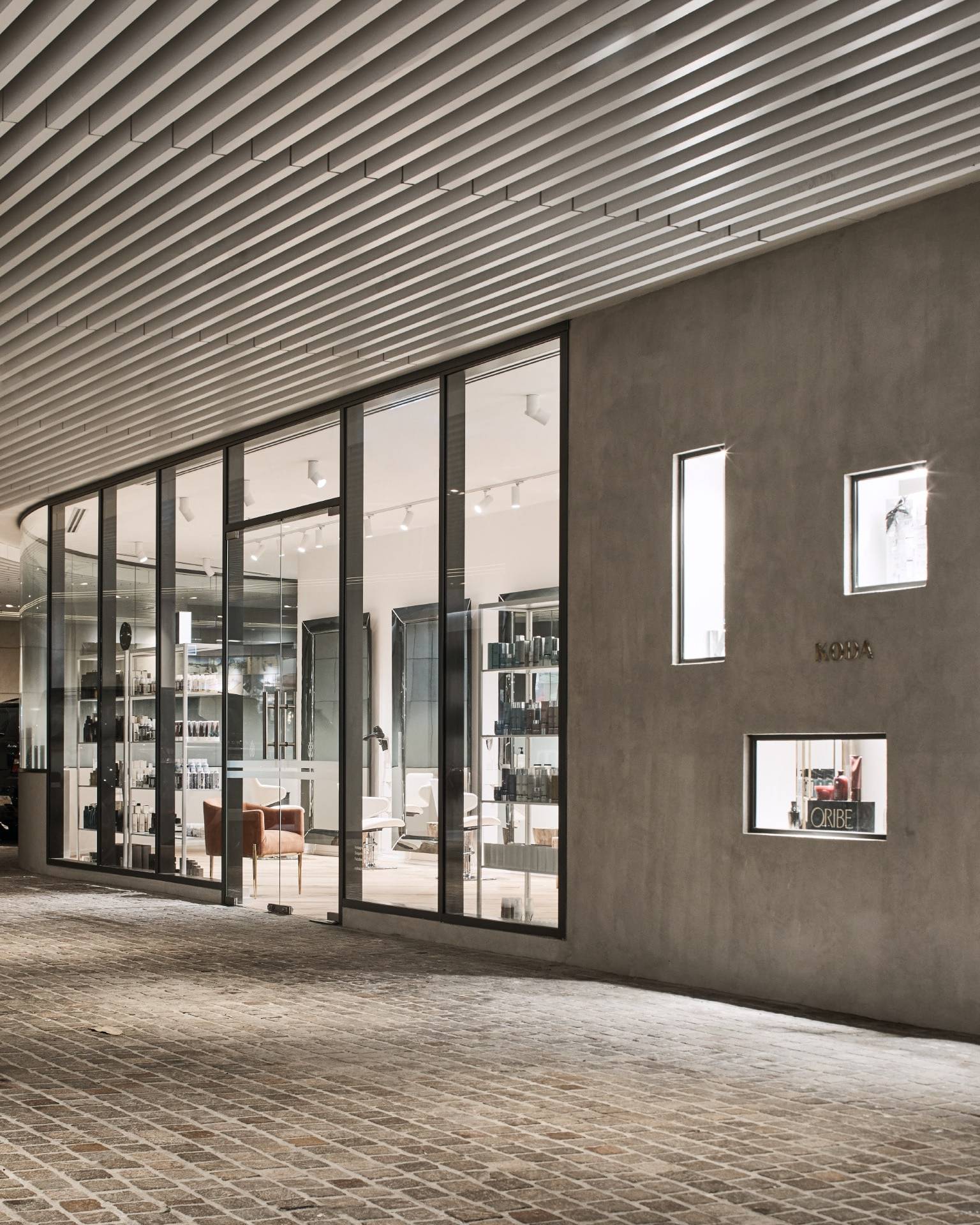 Koda Cutters, salon architecture and concrete facade